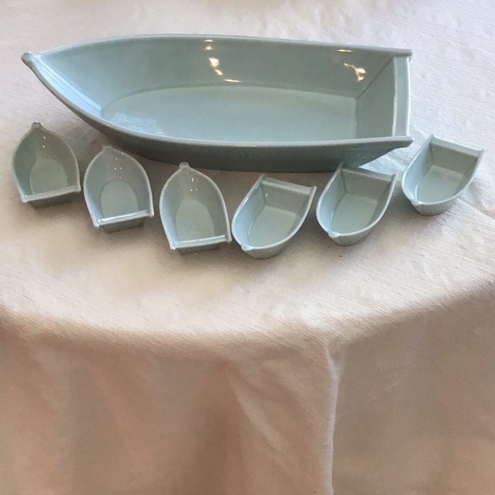 Beautiful Boat Shaped Ceramic Serving Bowl with 6 side dishes shaped as boats.